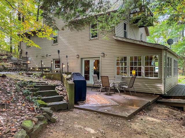 back of house with a patio area and french doors