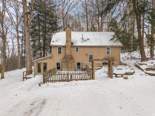 view of snow covered house