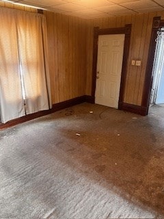 67 S Gamble St, Shelby, OH 44875 - carpeted spare room featuring wooden walls