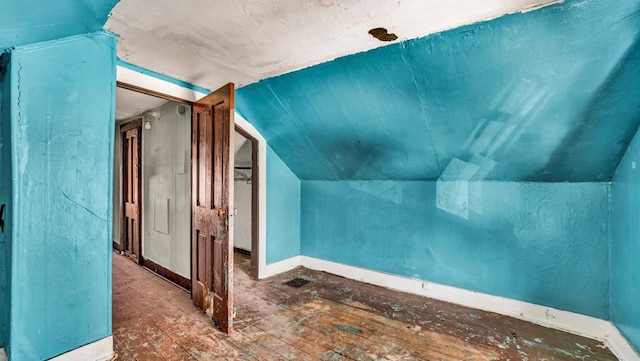 bonus room featuring vaulted ceiling