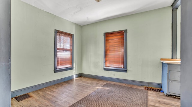 spare room with light wood-type flooring