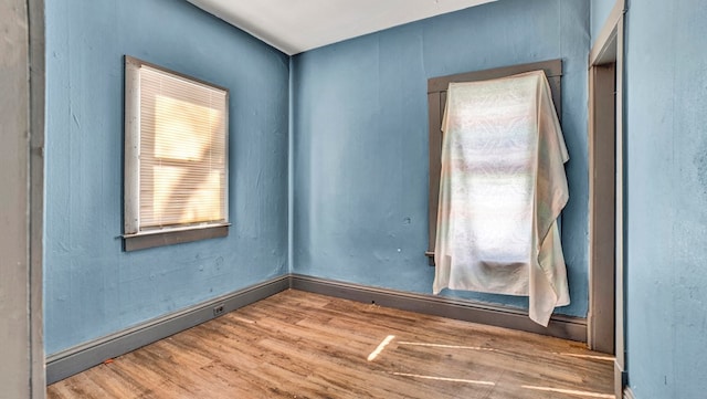 spare room featuring hardwood / wood-style floors