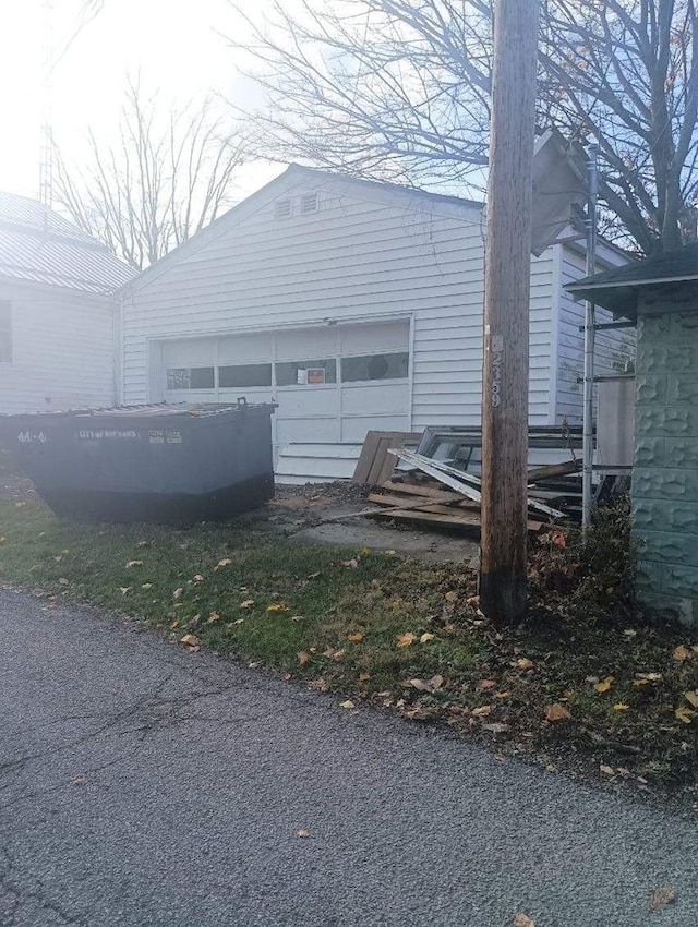 view of side of property with a garage