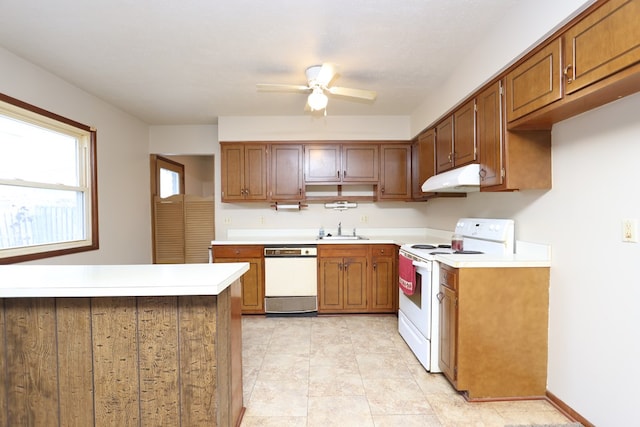 kitchen with sink, white appliances, and ceiling fan