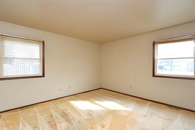 empty room featuring light colored carpet