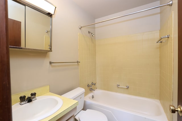 full bathroom with vanity, toilet, and tiled shower / bath combo