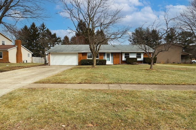 view of front of house featuring a garage and a front yard