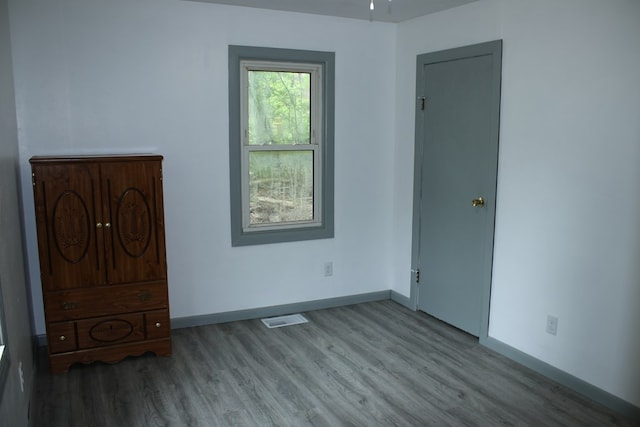 1192 Burger Ave, Mansfield, OH 44906 - unfurnished bedroom featuring wood finished floors and baseboards