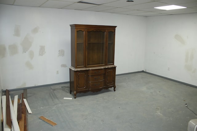 1192 Burger Ave, Mansfield, OH 44906 - unfurnished room featuring baseboards, concrete flooring, and a paneled ceiling