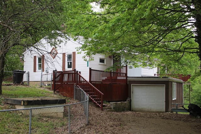 1192 Burger Ave, Mansfield, OH 44906 - back of house with dirt driveway, fence, and a garage