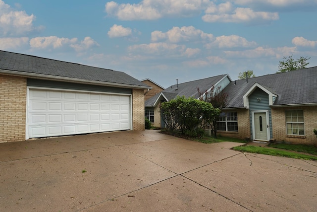 1690 Riva Ridge Dr, Mansfield, OH 44904 - view of front facade featuring brick siding and a garage