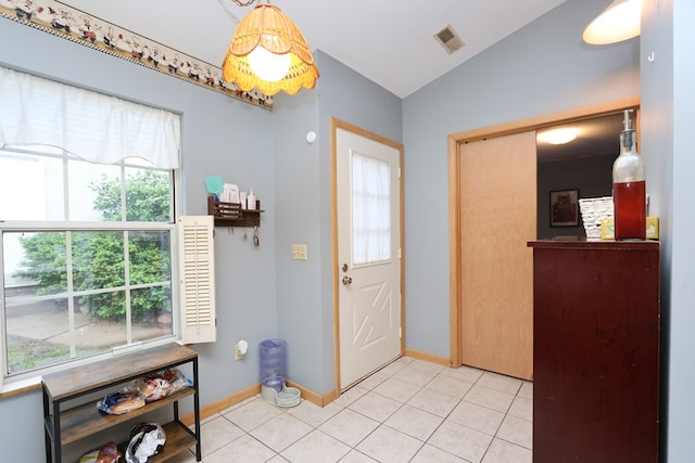 1690 Riva Ridge Dr, Mansfield, OH 44904 - foyer entrance with baseboards, light tile patterned floors, and lofted ceiling
