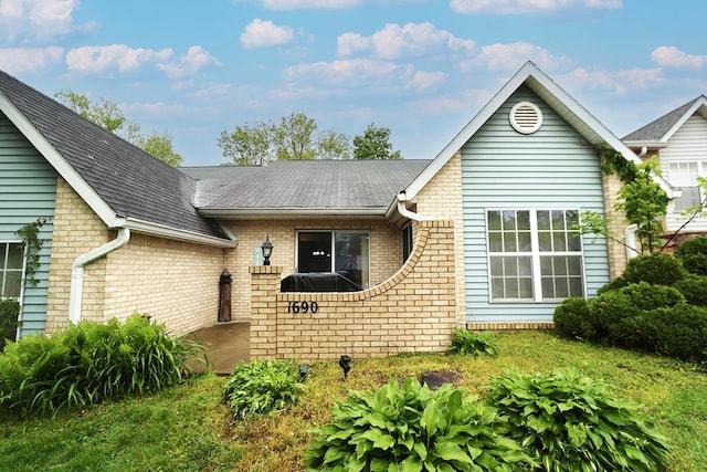 1690 Riva Ridge Dr, Mansfield, OH 44904 - view of front of home with brick siding and a shingled roof
