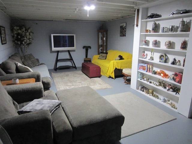 living area featuring finished concrete flooring