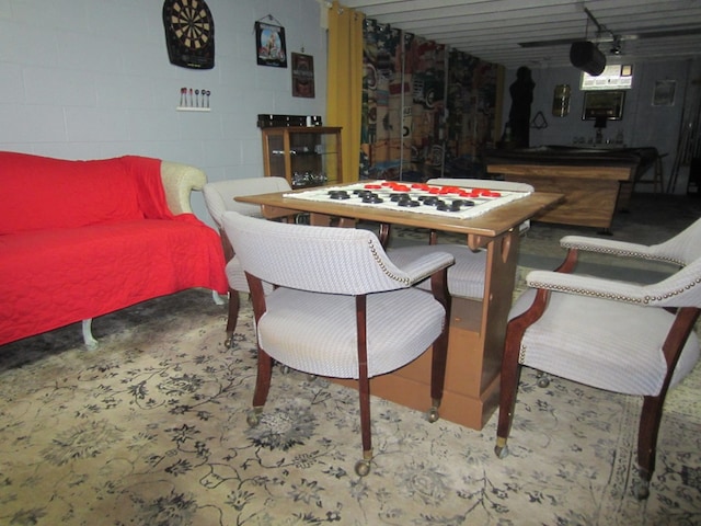 game room featuring concrete block wall and pool table