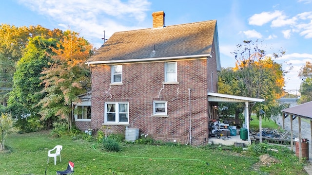 view of side of property with a yard