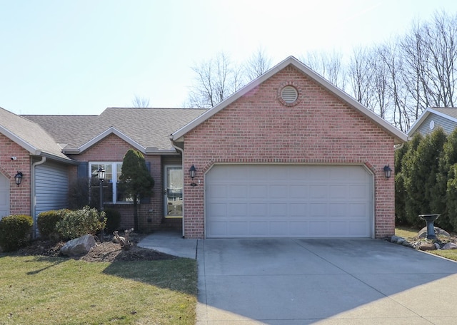 ranch-style home featuring a front yard, driveway, an attached garage, a shingled roof, and brick siding