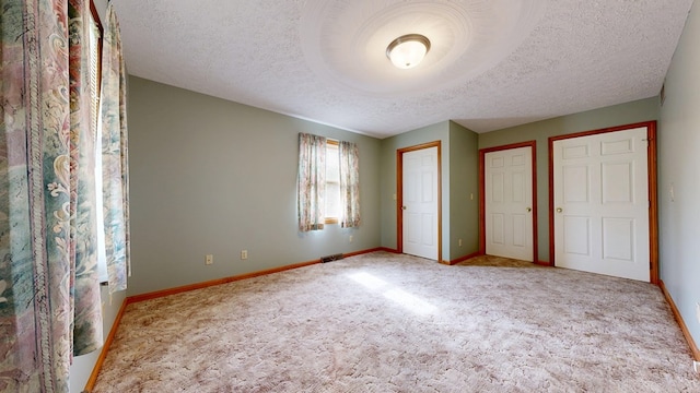 62 Elmridge Rd, Mansfield, OH 44907 - unfurnished bedroom featuring carpet, a textured ceiling, and baseboards