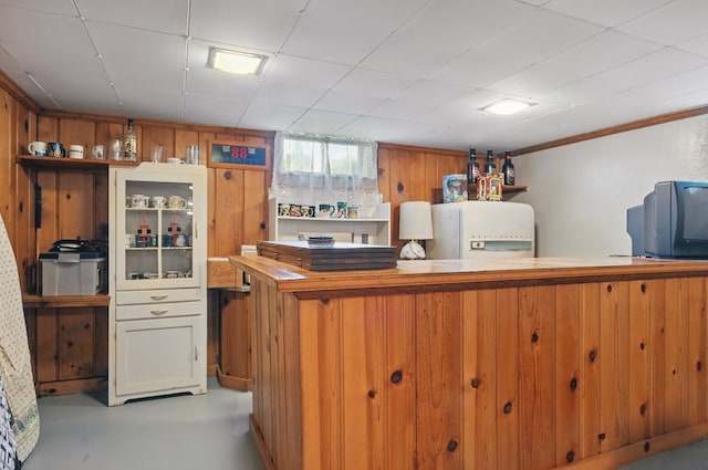40 Hopewell Ave, Tiffin, OH 44883 - kitchen featuring fridge and finished concrete flooring