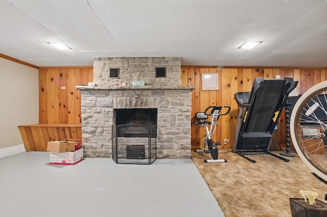 40 Hopewell Ave, Tiffin, OH 44883 - workout room with wood walls, baseboards, and a fireplace