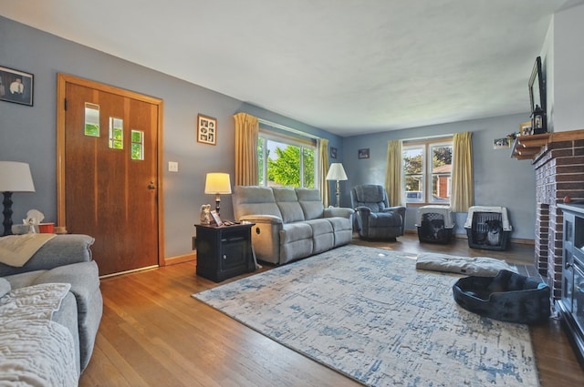 40 Hopewell Ave, Tiffin, OH 44883 - living area with wood finished floors, a fireplace, and baseboards