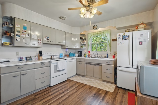 40 Hopewell Ave, Tiffin, OH 44883 - kitchen featuring white appliances, open shelves, gray cabinetry, a sink, and dark wood-style flooring