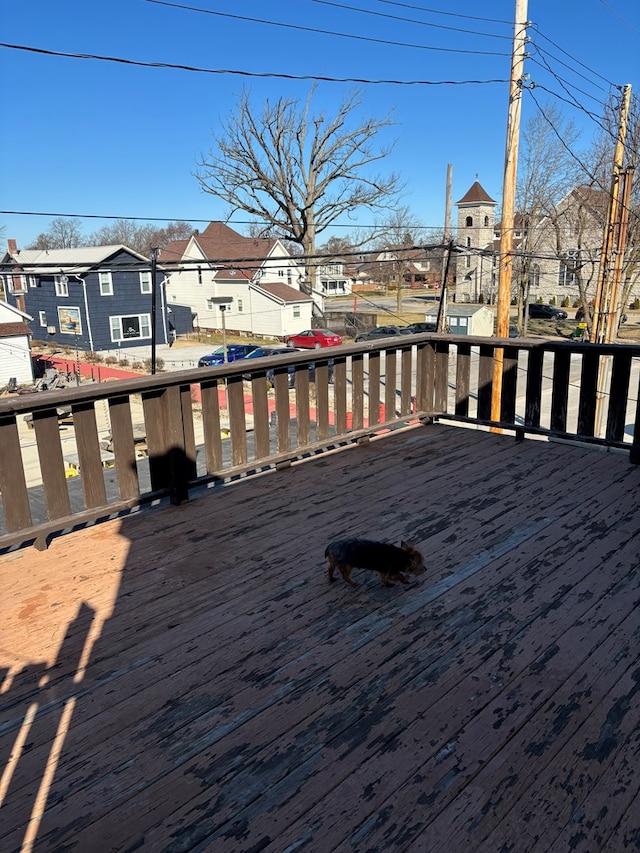 wooden deck featuring a residential view