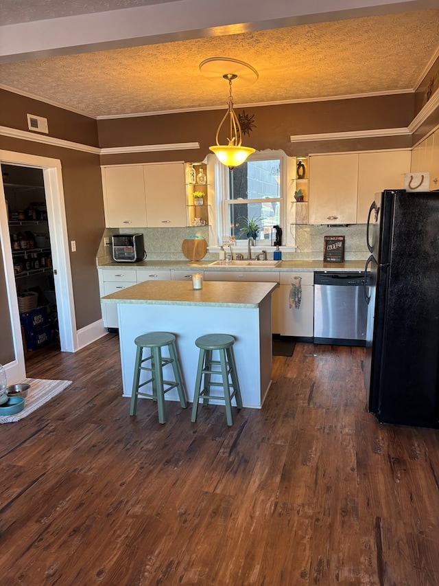 kitchen featuring a center island, dark wood-type flooring, dishwasher, freestanding refrigerator, and open shelves