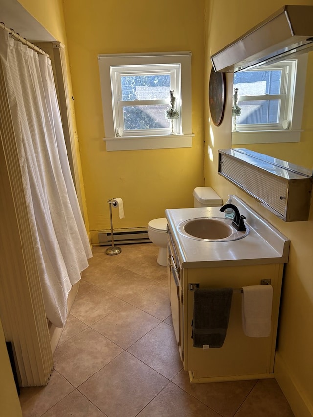 full bath featuring tile patterned floors, toilet, vanity, and a baseboard radiator