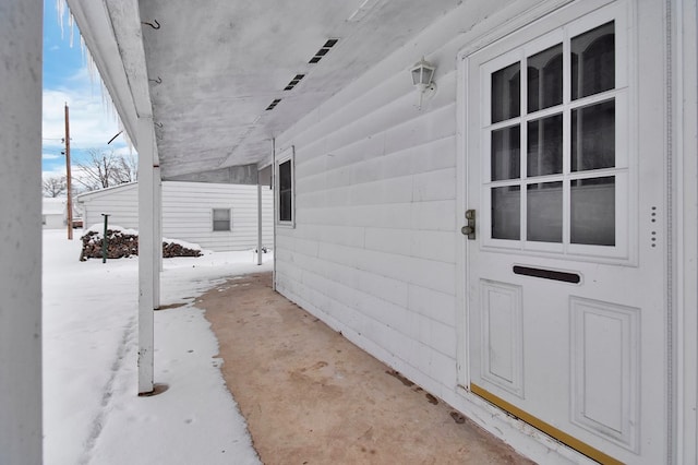 view of snow covered property entrance