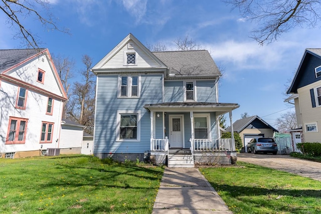 view of front of home featuring a porch, central AC, and a front lawn