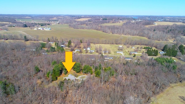 birds eye view of property with a rural view