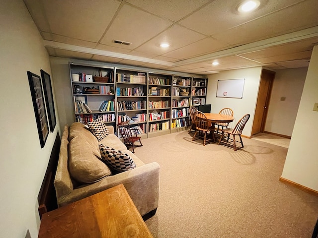 sitting room with a paneled ceiling, visible vents, recessed lighting, carpet flooring, and baseboards
