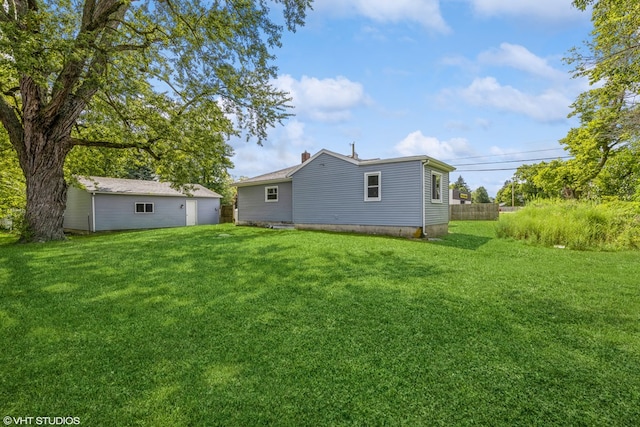 back of property featuring a lawn