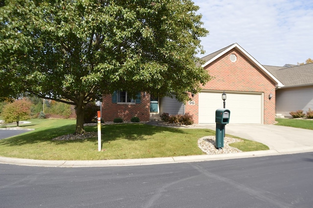 view of front facade with a front lawn and a garage