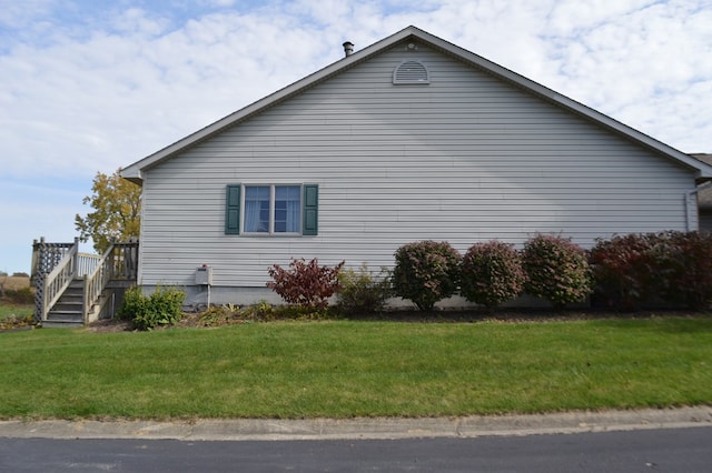 view of home's exterior featuring a yard