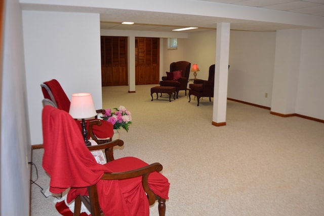 living area featuring light colored carpet