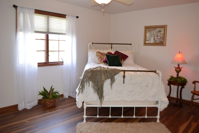 bedroom featuring dark hardwood / wood-style floors and ceiling fan