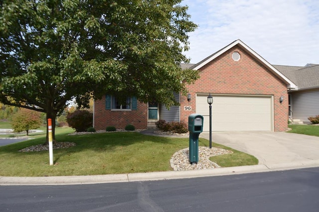 view of front of home featuring a front yard and a garage