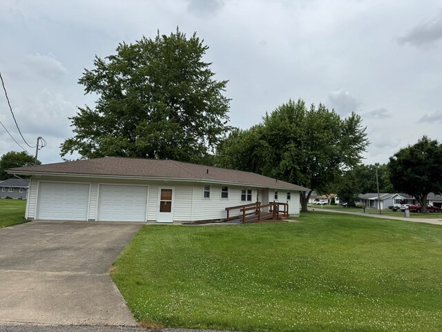 763 Sunnyside Dr, Galion, OH 44833 - ranch-style house with a front lawn, driveway, and an attached garage