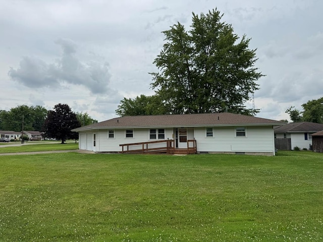 763 Sunnyside Dr, Galion, OH 44833 - rear view of property with a lawn, a wooden deck, and an attached garage