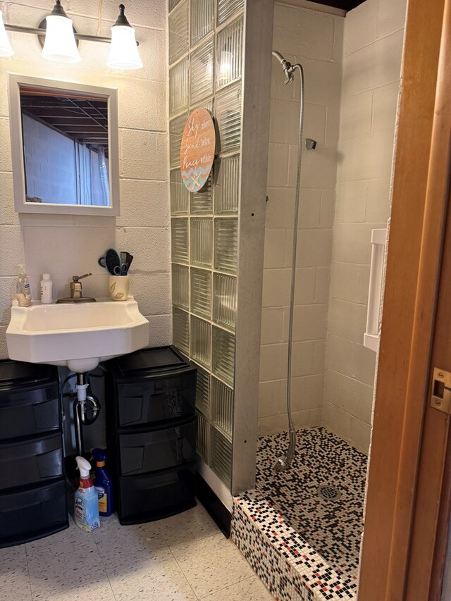 763 Sunnyside Dr, Galion, OH 44833 - full bath featuring a tile shower, concrete block wall, and tile patterned floors