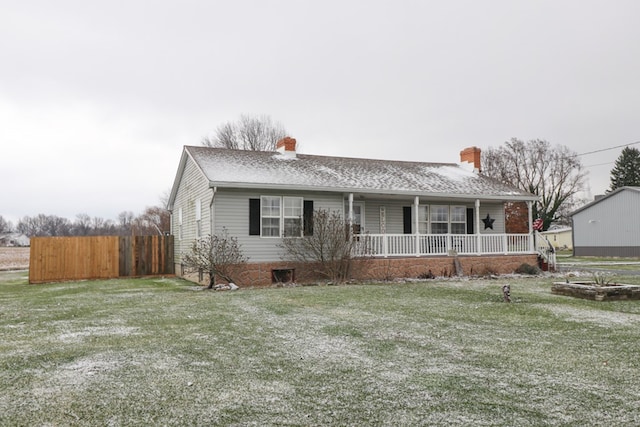 single story home with a front lawn and a porch