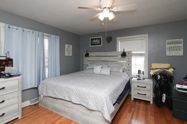 bedroom featuring hardwood / wood-style flooring and ceiling fan