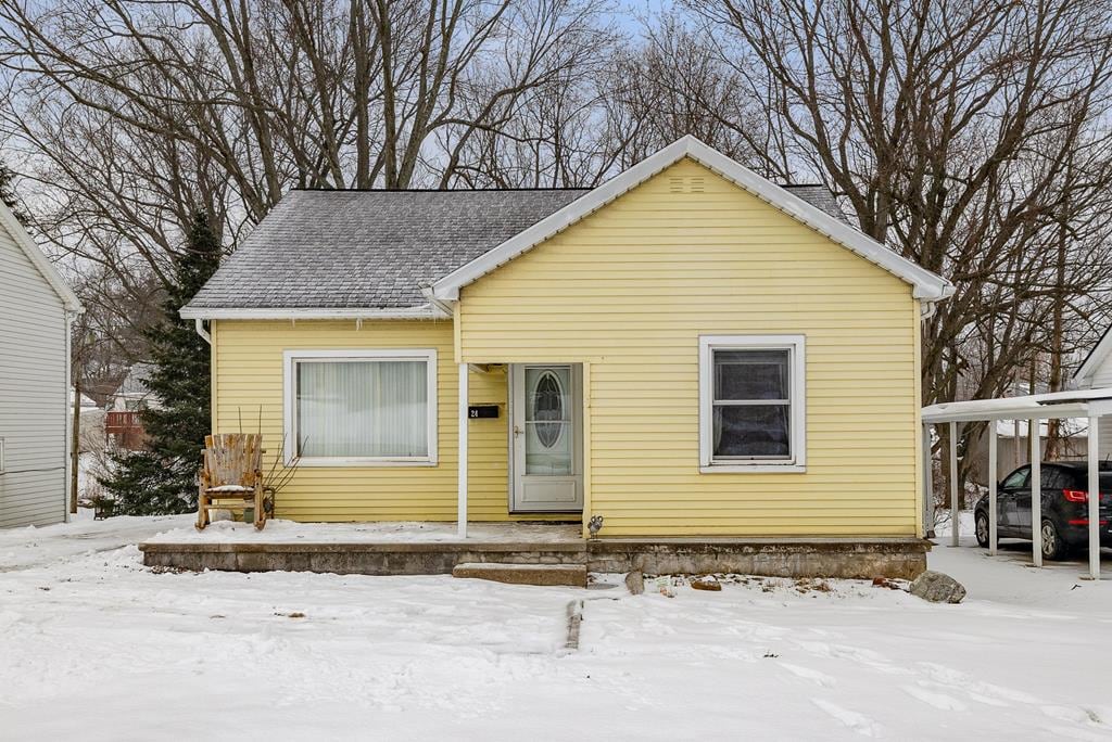 bungalow featuring a carport