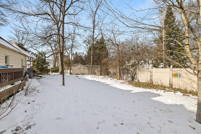 view of yard layered in snow