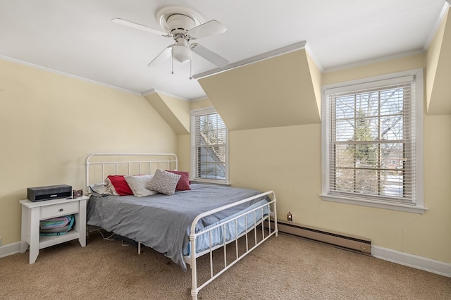 carpeted bedroom with baseboard heating, ceiling fan, and crown molding