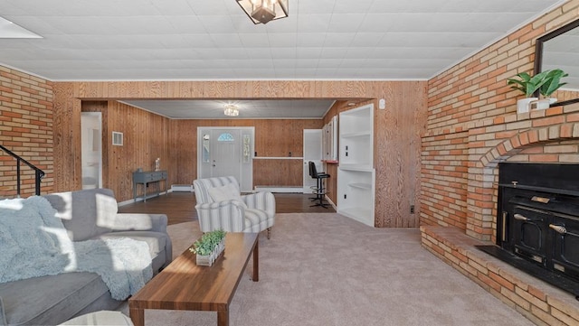 carpeted living room with brick wall, ornamental molding, wooden walls, and a baseboard radiator