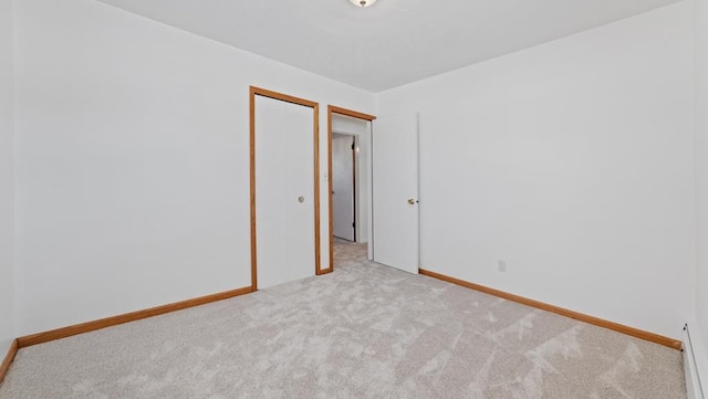 empty room featuring light colored carpet