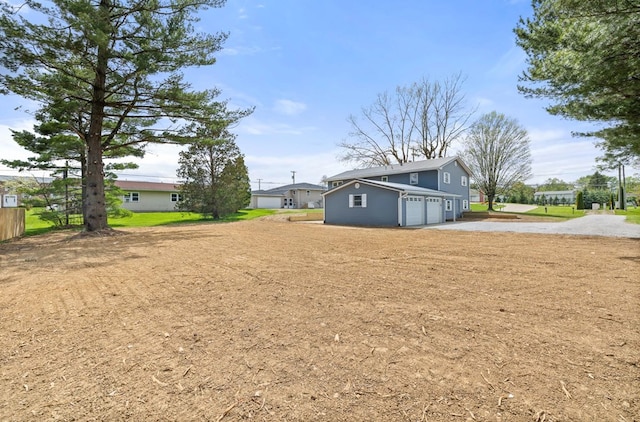 view of yard featuring a garage